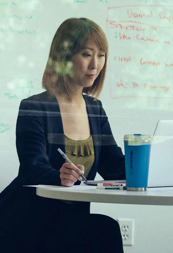 Asian woman working on her laptop